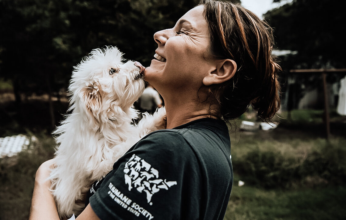 Woman Holding Dog