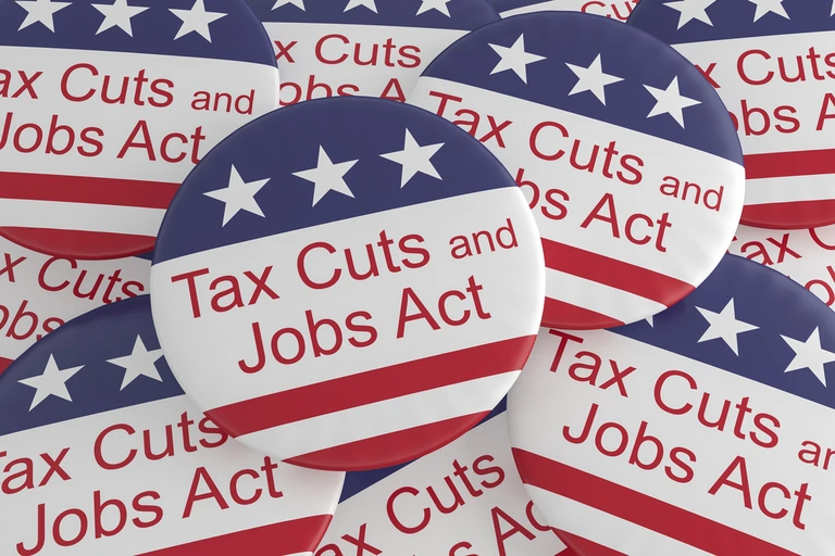 pile of tax cuts and jobs act buttons