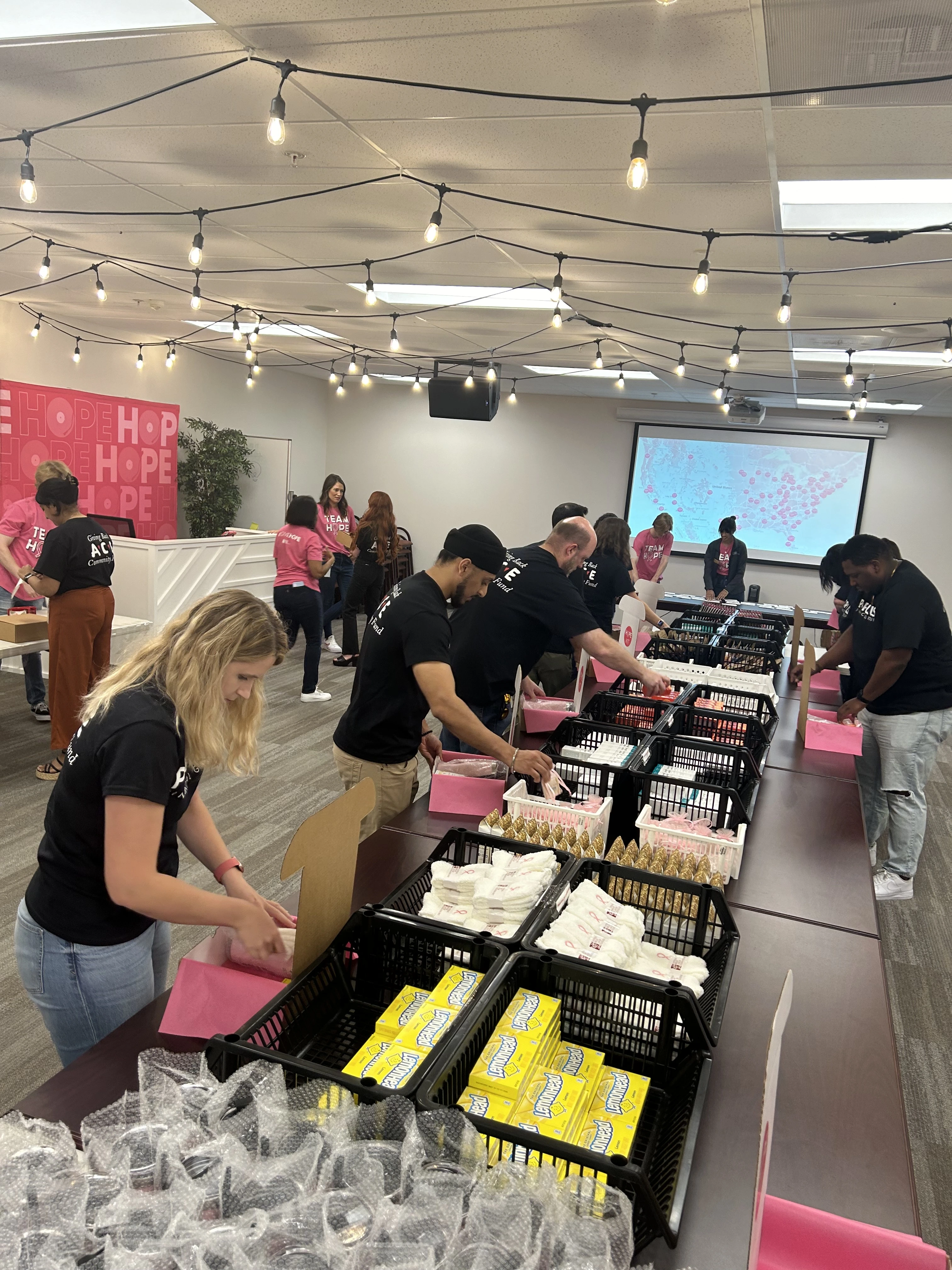 Populus Marketing Team Volunteers at NBCF headquarters packing HOPE kits
